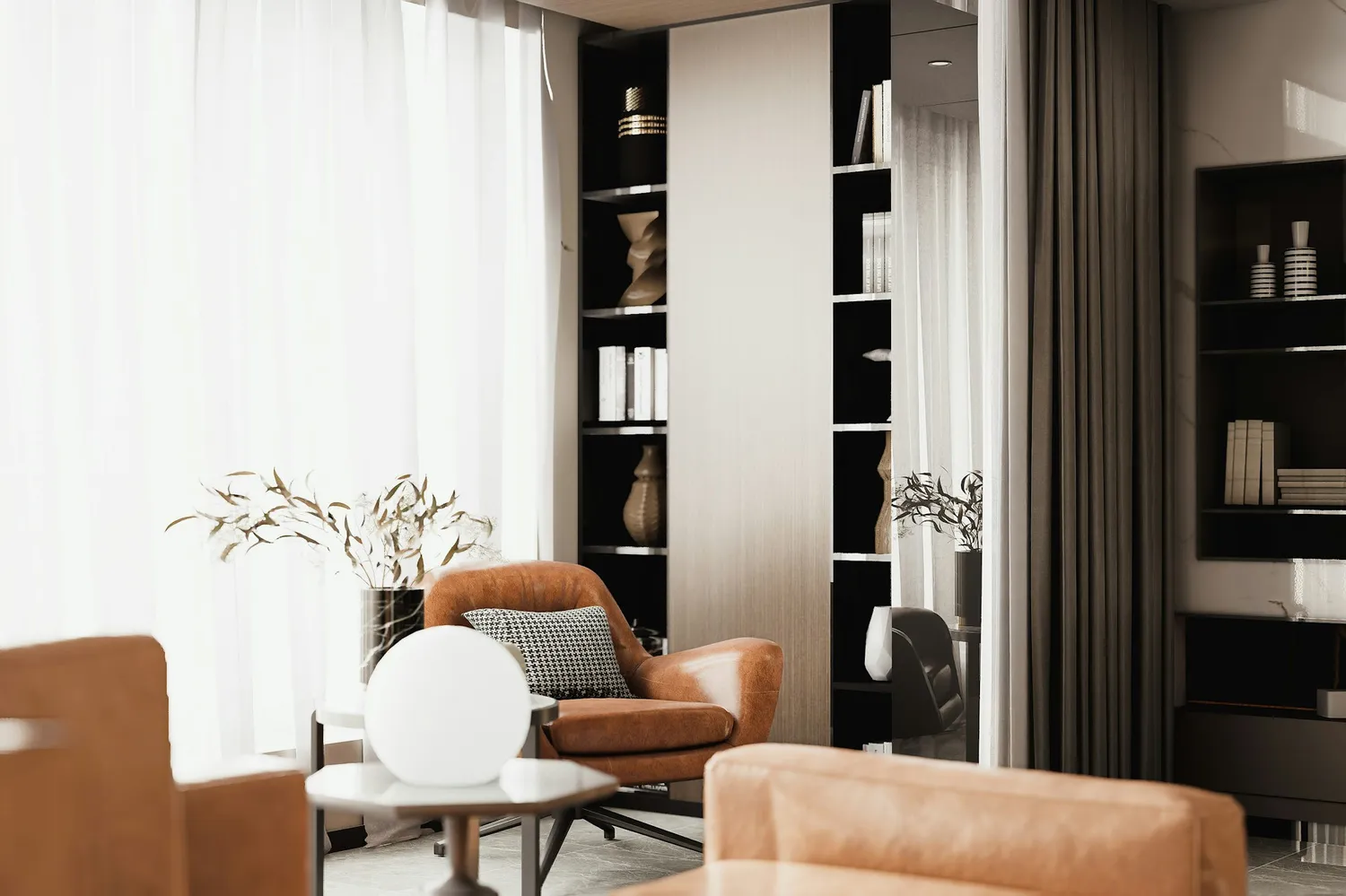 Praktijkruimte met twee fauteuils, een ronde lamp en een boekenkast